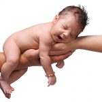surrogacy baby in hands