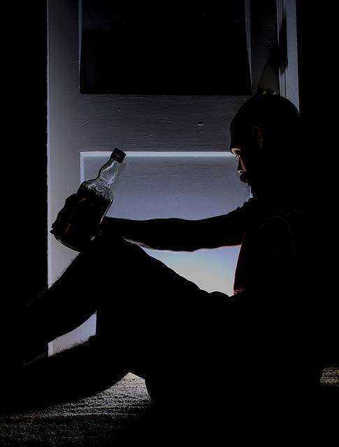 Man Drinking in Dark: DIY Family Law Australia